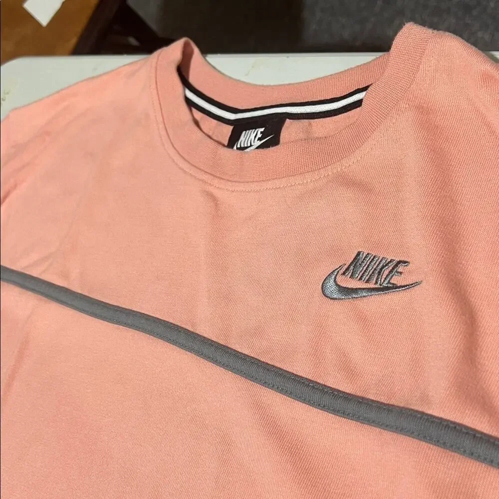 Nike women’s 1X long sleeve tee, peachy-pink with gray band
